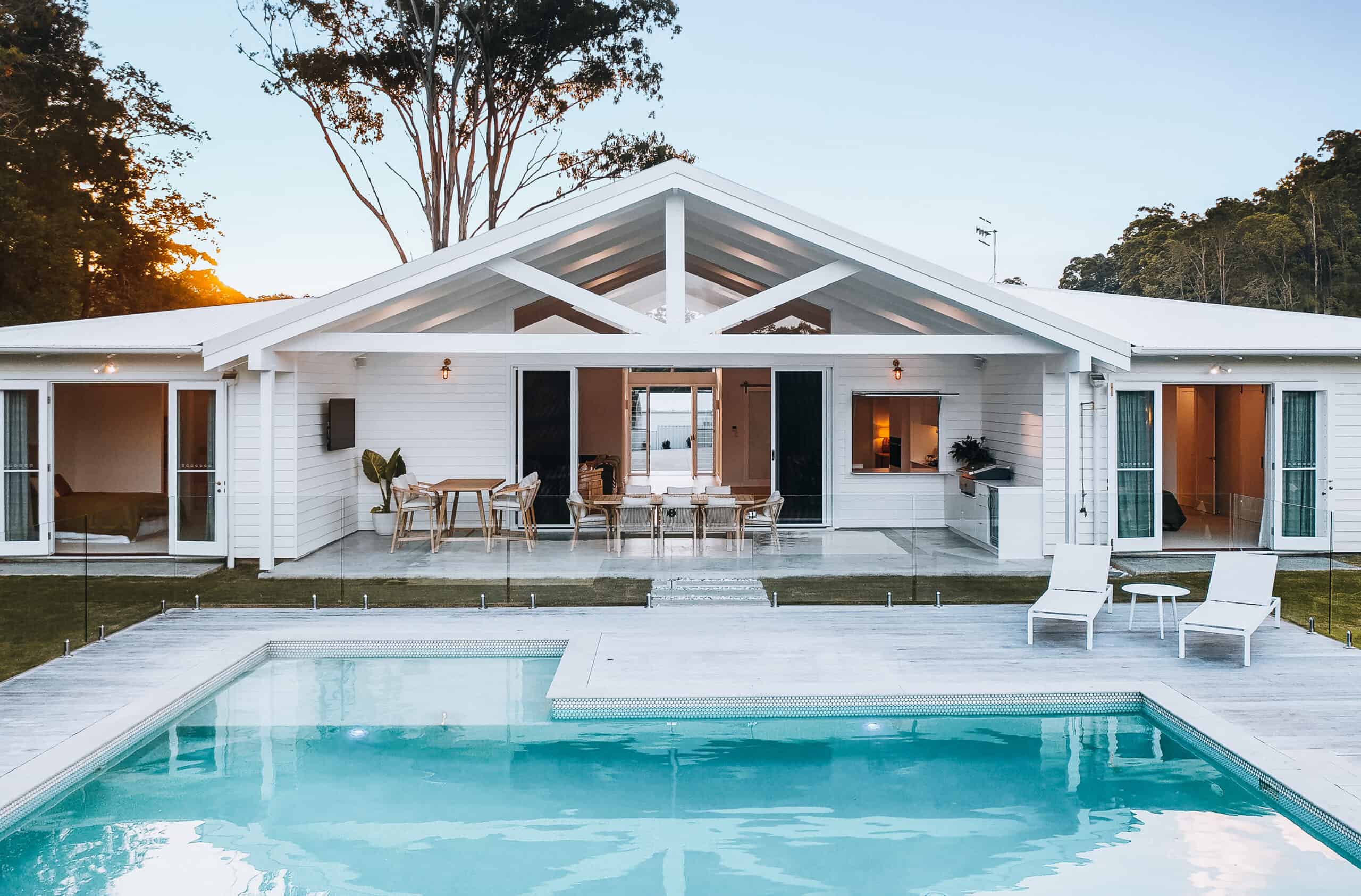 Gable-roof custom home with a resort-style pool, built by FEZ Constructions on the Sunshine Coast